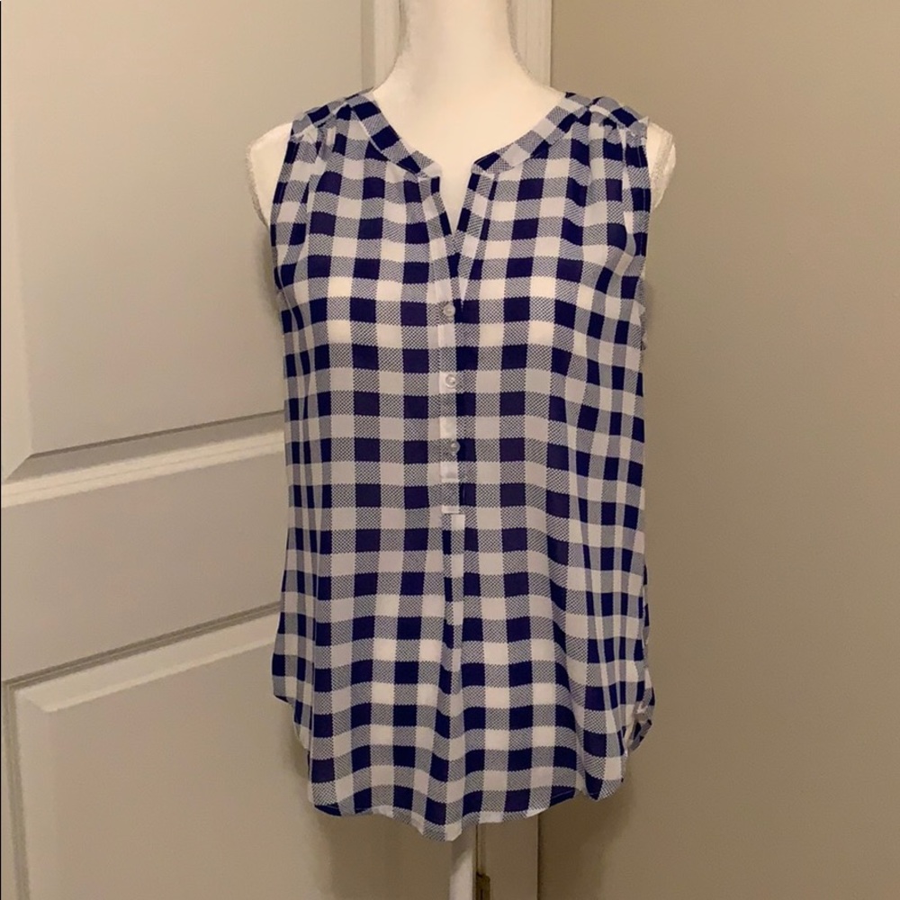 Blue and white gingham pattern top.